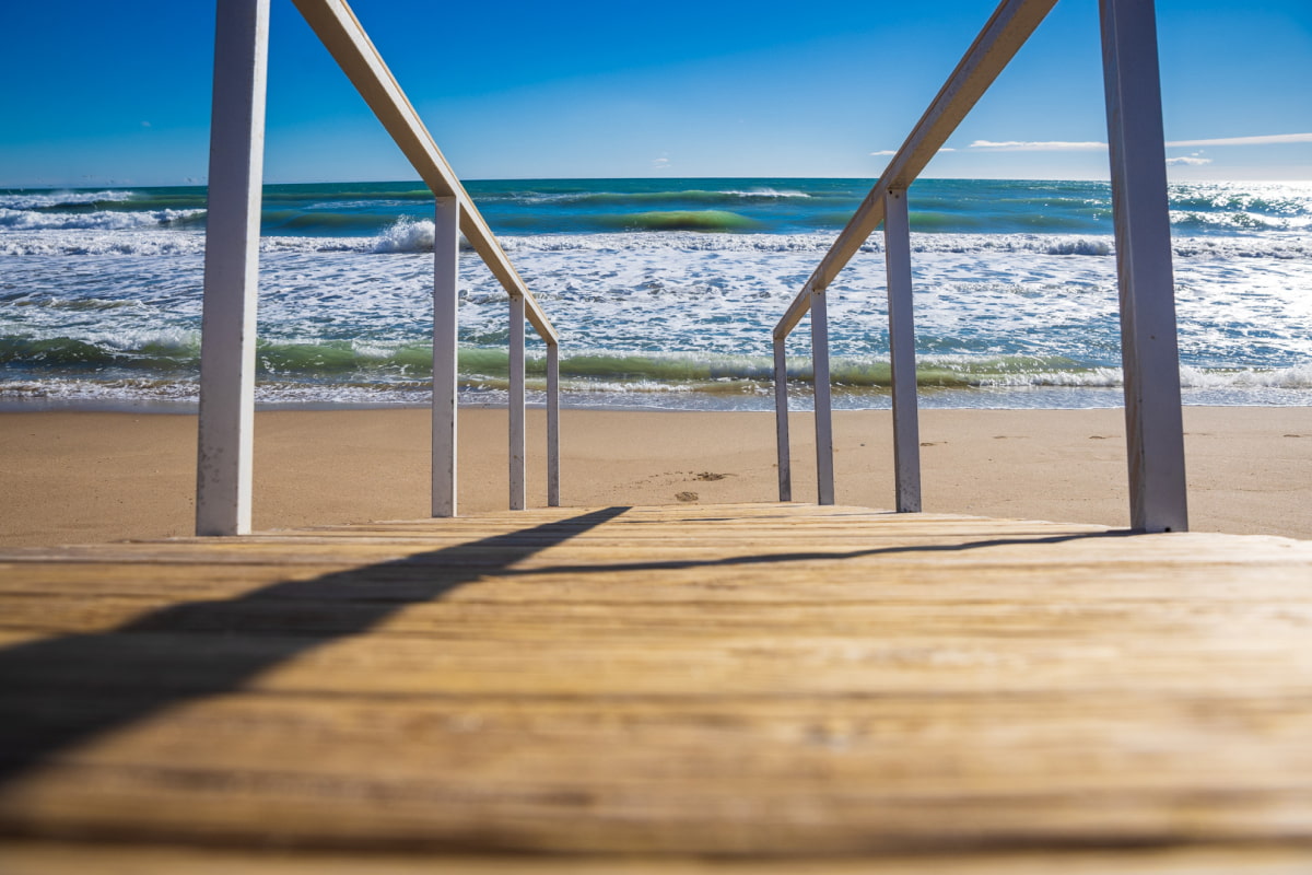 Access walkway to Calafell Beach, with the sea in the background.