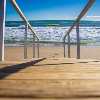 Access walkway to Calafell Beach, with the sea in the background.